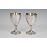 A pair of George III silver goblets John Denzilow, London, 1790, bright-cut with foliate band to top