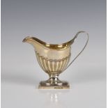 An elegant George III silver helmet cream jug Daniel Pontifex, London, 1794, having stylised