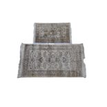 Two 20th century Indian part silk rugs on ivory ground the larger with a central medallion and