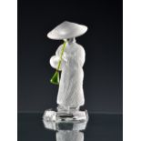 A Saint-Louis crystal musician figure 'Chinese flute player' the figure modelled in standing