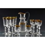 A matched part suite of gilt decorated cut glass drinking glasses, probably by St Louis Crystal