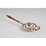 A Channel Islands silver tea strainer by Bruce Russell of Guernsey date marked 1998, with turned