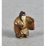 A Japanese lacquered wood netsuke of a noh actor probably 19th / early 20th century, unsigned, in