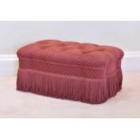A large Victorian style pouffé late 20th century, in buttoned, deep pink upholstery with tasseled
