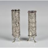 Two Chinese silver sleeve form stem vases early 20th century, one decorated with a dragon, the other