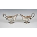 A closely matched pair of early George III pedestal sauce boats David Whyte & William Holmes / Lewis