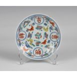 A Chinese porcelain bat and shou Doucai saucer Jiaqing six character seal mark in underglaze blue