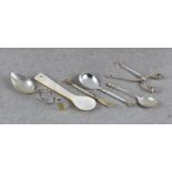 A pair of Georg Jensen silver sugar tongs Acorn pattern, with foliate bowls, sprung hinge, impressed