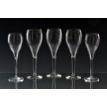 A set of six Veuve Cliquot champagne glasses with printed marks to base, 20.25cm. high; together