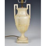 A neo-classical carved alabaster vase lamp angular handles and acanthus leaf decoration, raised on