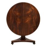 A Victorian rosewood breakfast tilt-top table the round top over a cannon barrel column with trefoil