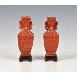 A pair of Chinese coral glazed miniature square baluster vases probably 19th century, archaic