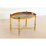 A Regency style oval tole ware tray on stand late 20th century, the tray painted with a central