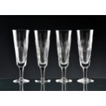 A set of four Stuart Crystal Salisbury pattern champagne flutes etched marks, 7 3/8in. (18.75cm.)