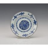 A Chinese export blue & white plate 18th century, painted with flowers and pomegranates, 9in. (22.
