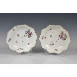 A pair of Meissen lotus flower shaped dishes 19th century, painted with scattered flowers, gilt rim,