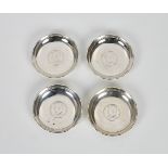 A set of four Hong Kong silver pin dishes by Wai Kee, with inset HK junk dollar coins, 3½in. (8.