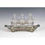 A good George III silver triple decanter stand William Kingdon, London 1812, of boat form with