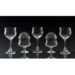 A set of eleven wine glasses 1980s-90s, the tulip bowls on slender, waisted stems and conical