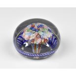 A Baccarat close-packed millefiori mushroom glass paperweight c.1850, the well-formed central tuft