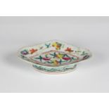 A Chinese famille rose stem / footed dish early 20th century, of lozenge form, painted with