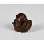 A Japanese carved boxwood netsuke of two rats locked in battle having good naturalistic textured fur