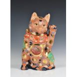 A large Satsuma glazed terracotta 'Lucky Cat' figure modern, coloured in bright reds, greens,