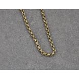 A 9ct gold faceted cable link chain, 32½in. (82.5cm.) long.