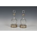 A pair of Elizabeth II silver mounted cut glass decanters, C J Vander Ltd, Birmingham, 1990, 11¾