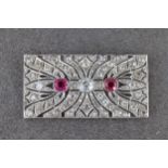 A fine Art Deco platinum, diamond and synthetic ruby plaque brooch, 1930s, the rectangular panel