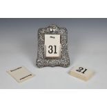 A Victorian silver easel back perpetual calendar, James Deakin & Sons, Chester, 1899, of shaped