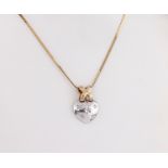 A diamond set 9ct two colour gold heart pendant, the domed, white gold heart suspended from a
