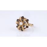 A vintage 9ct yellow gold, sapphire and pearl floral ring, hallmarked London 1967, the six chased