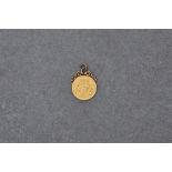A 1913 George V gold sovereign with attached 9ct gold pendant mount,