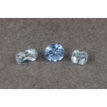 Three loose, unmounted gemstones, comprising two aquamarines, pale blue-green, one octagon cut, 9