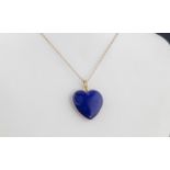 A 14ct gold and lapis lazuli heart pendant, hallmarked, 33mm. drop, on a 9ct gold cable link chain.
