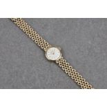 A Record de Luxe 9ct gold ladies bracelet watch, manual wind, silvered 16mm. dial with gilt batons