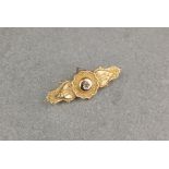 A 9ct gold Etruscan Revival brooch, with rose cut diamond to centre and locket panel verso,