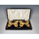 A cased pair of Arts and Crafts novelty silver gilt butterfly trays or dishes, Sydenham Brothers,