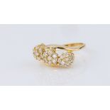 An 18ct yellow gold and diamond triple floral cluster ring, the three diagonally set clusters each