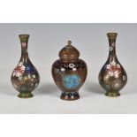 A pair of small Japanese cloisonné enamel bottle vases, Meiji period (1868-1912), the black ground