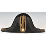 Black felt Royal Navy midshipman's bicorn hat, owner's name inscribed indistinctly in ink inside "
