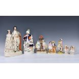 A collection of Staffordshire flatback figures, the largest 'QUEEN & KING OF SARDINIA', 13¼in. (33.