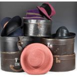 Five vintage leather hat boxes with a collection of various hats, to include a Siggi 100% straw hat;