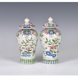 A closely matched pair of 19th century famille rose porcelain covered vases by Samson of Paris,