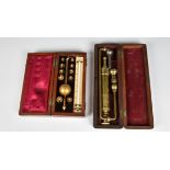 A Sikes hydrometer in fitted case, together with a cased Surgical brass pump. (2)