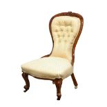 A Victorian walnut nursing chair,