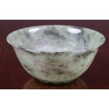 A carved green jade style hardstone bowl, 20th century, 4 7/8 (12.4cm.) diameter, 2¼in. (5.7cm.)