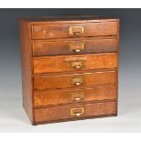 A mid-century oak six drawer collectors or desk top chest, 1940s-50s, plain rectangular form, the