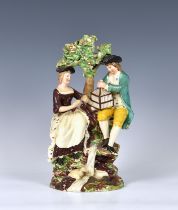 A large Staffordshire Walton style Pearlware pottery figure group, second quarter 19th century,